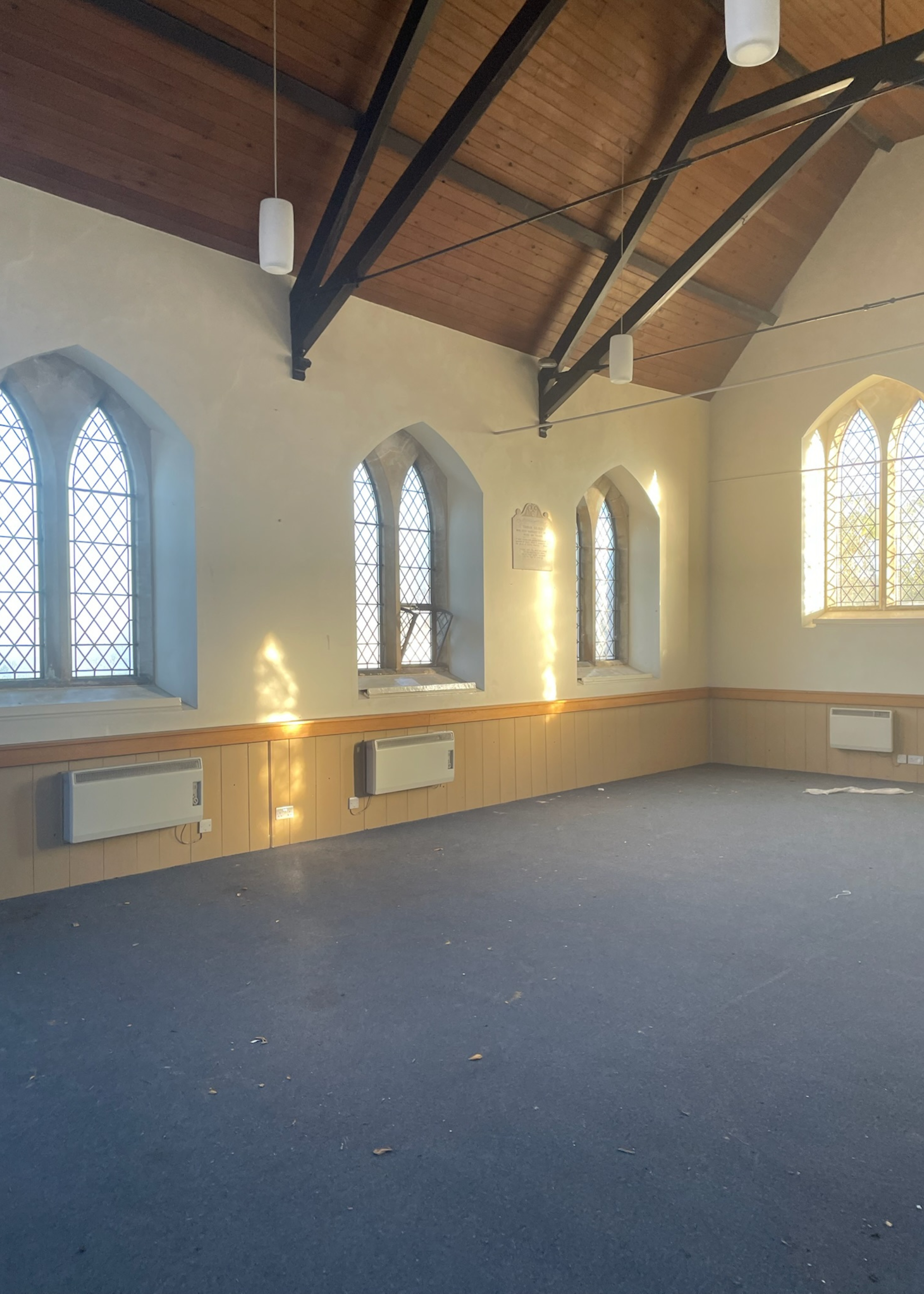 a chapel hall with blue carpets