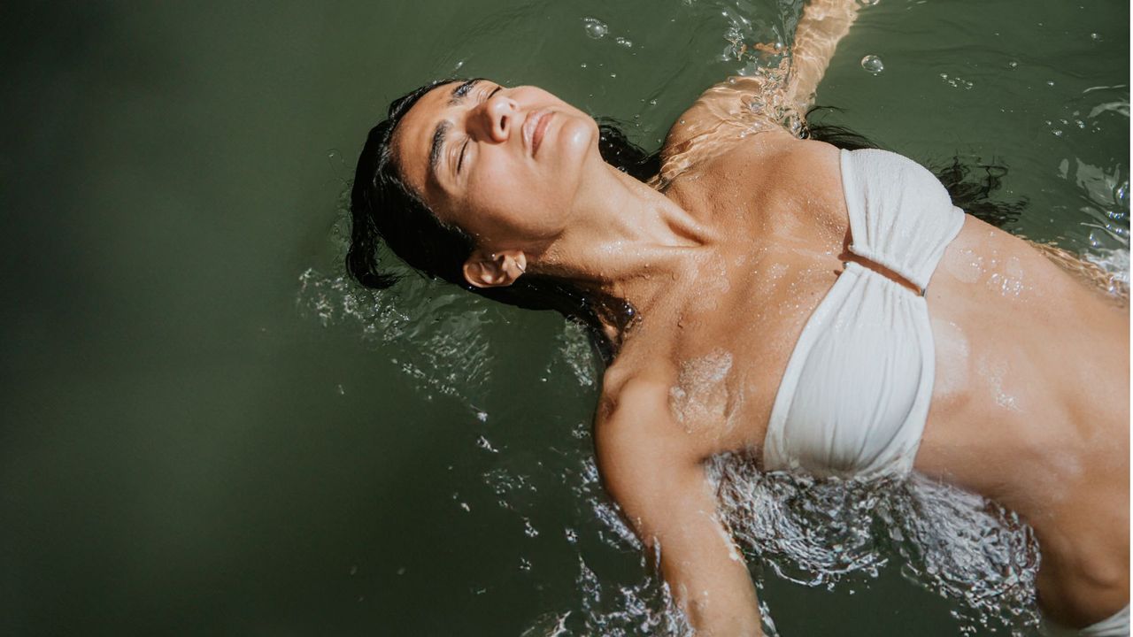 Summer depression: A woman floating in the sea