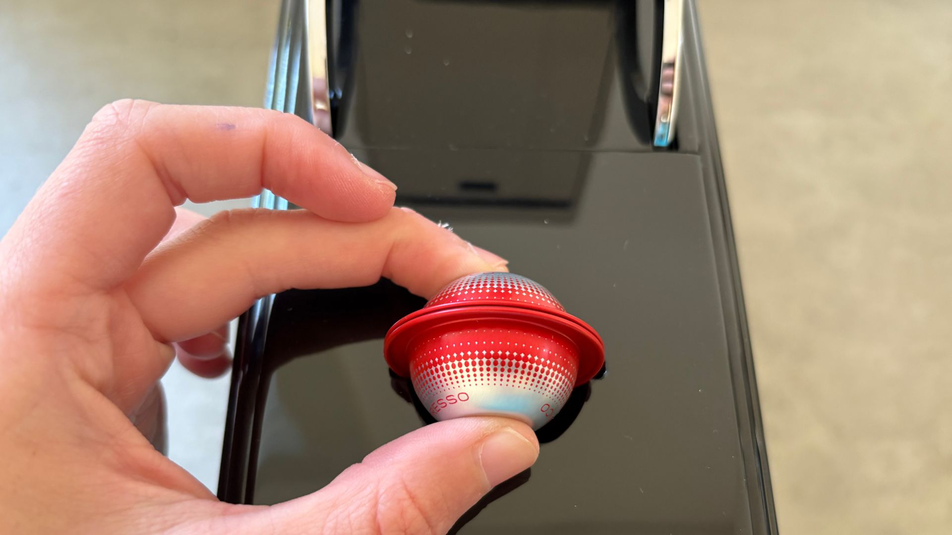 pod going into the illy X3 coffee machine
