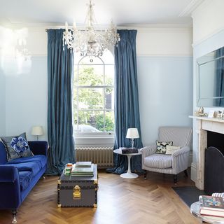 sitting room with blue wall and sofa