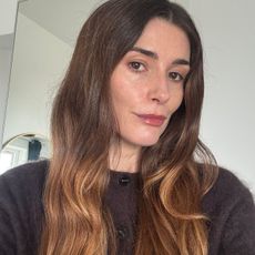 A selfie of Eleanor wearing Violette FR lip balm in Dahlia Noir