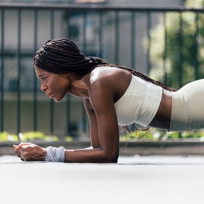 A woman doing a Copenhagen plank