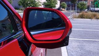 Close-up view of the front of a Toyota Mirai (2021) side mirror