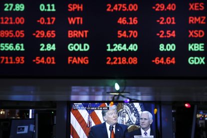 President Trump on TV beneath the stock listings