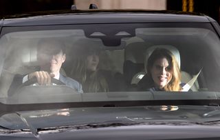 Princess Beatrice and Edoardo Mapelli Mozzi smiling and riding in a car