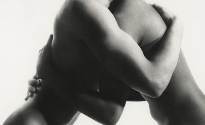 daisy walker black and white image of two men embracing against white background