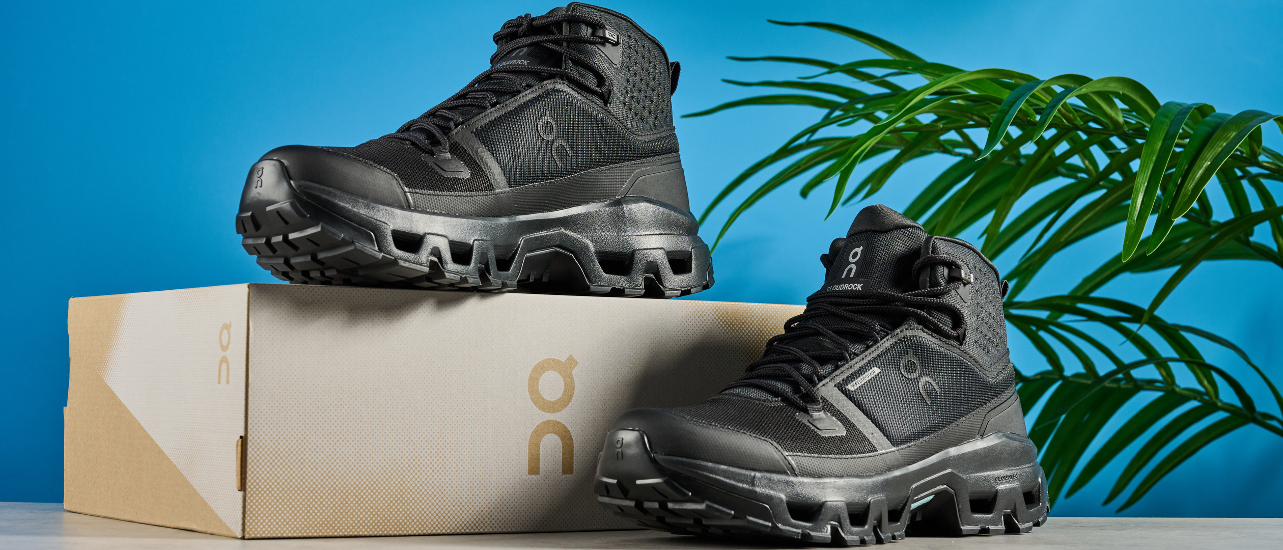 The On Cloudrock Mid WP boots with one boot on top of the box