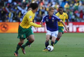 Keisuke Honda in action for Japan against Cameroon at the 2010 World Cup.
