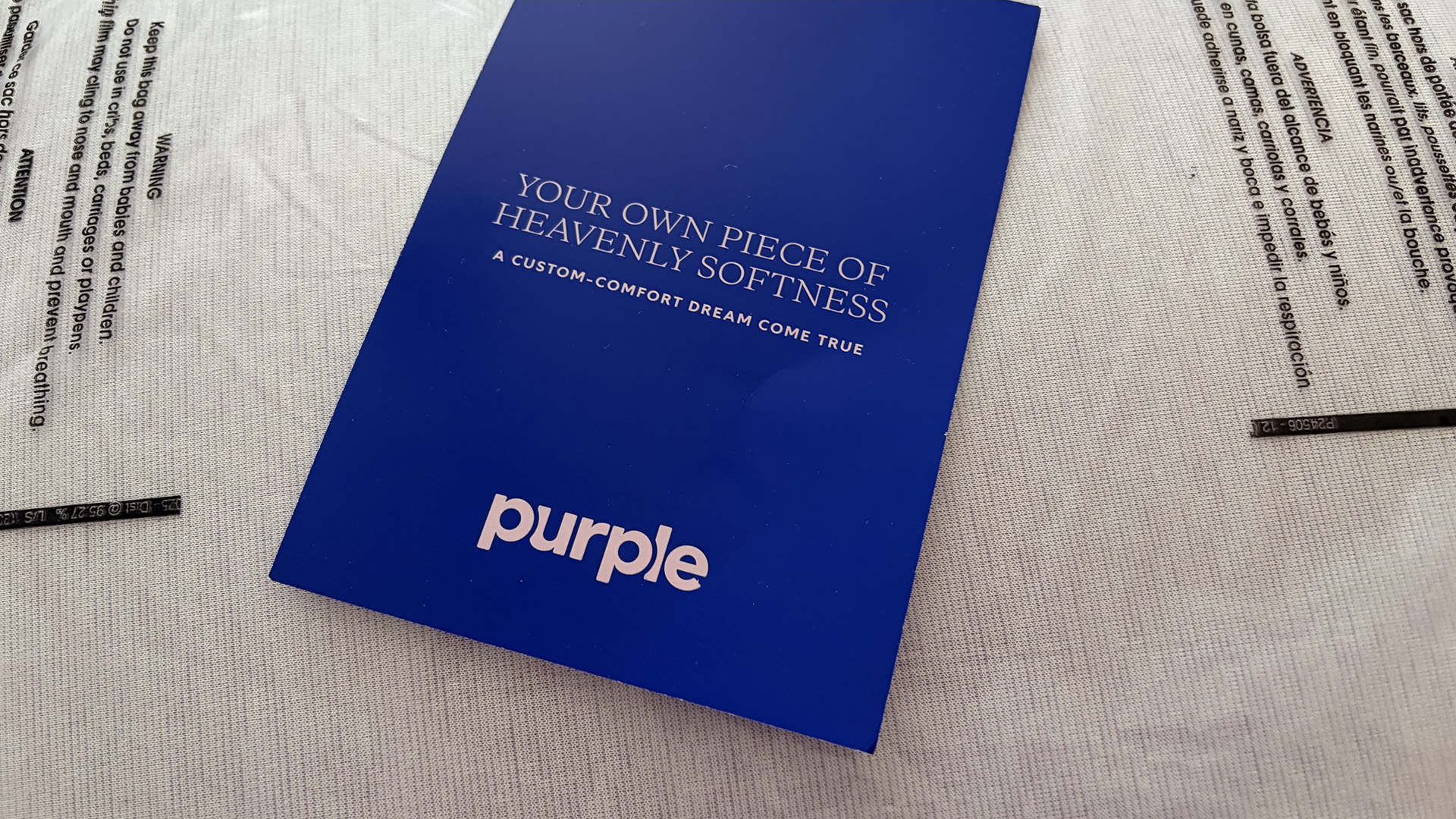 The Purple DreamLayer Pillow in its delivery package, with the Purple leaflet placed on top