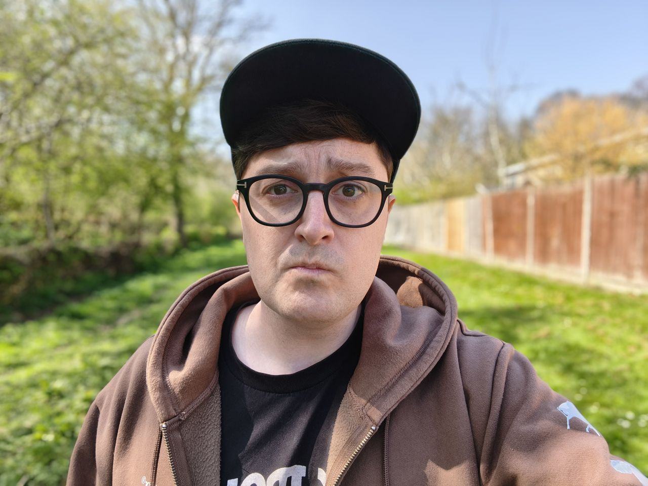 Person taking a selfie outside in a garden