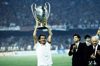 Franco Baresi lifts the European Cup trophy after AC Milan's victory over Steaua Bucharest in the 1989 final.