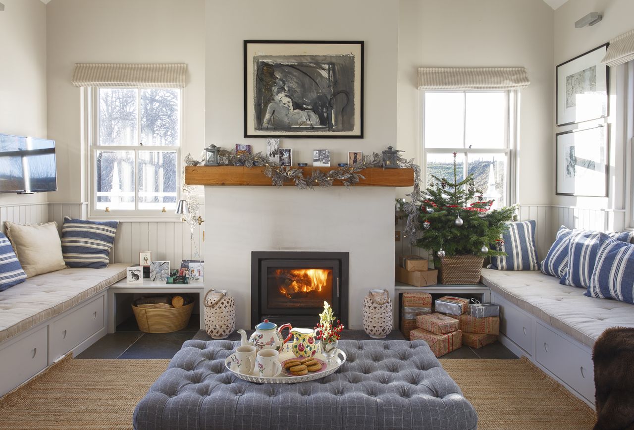 Christmas tree with sofas and fireplace