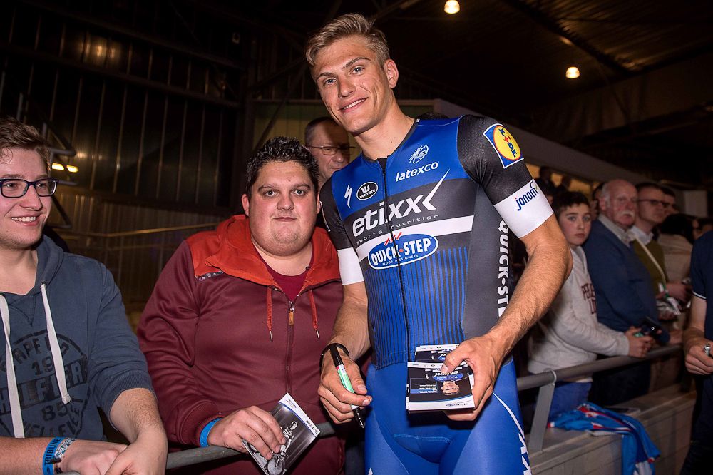 Marcel Kittel poses for a photo with a fan at the Etixx-QuickStep team presentation.