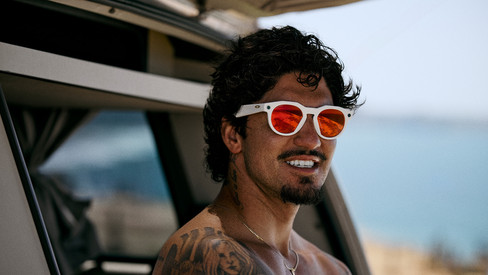 Official lifestyle shots of a person wearing Oakley Meta HSTN smart glasses