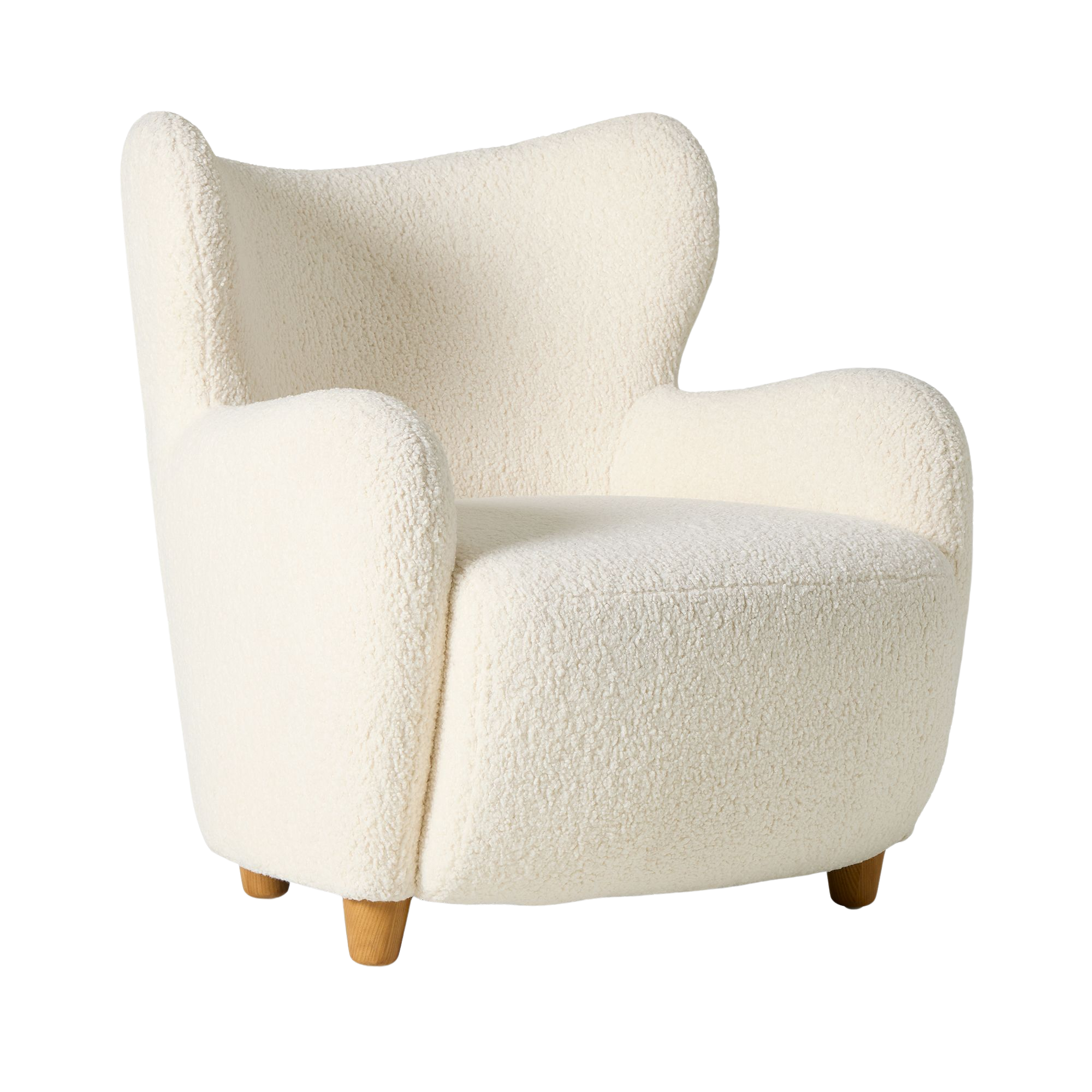 a boucle chair with a winged back