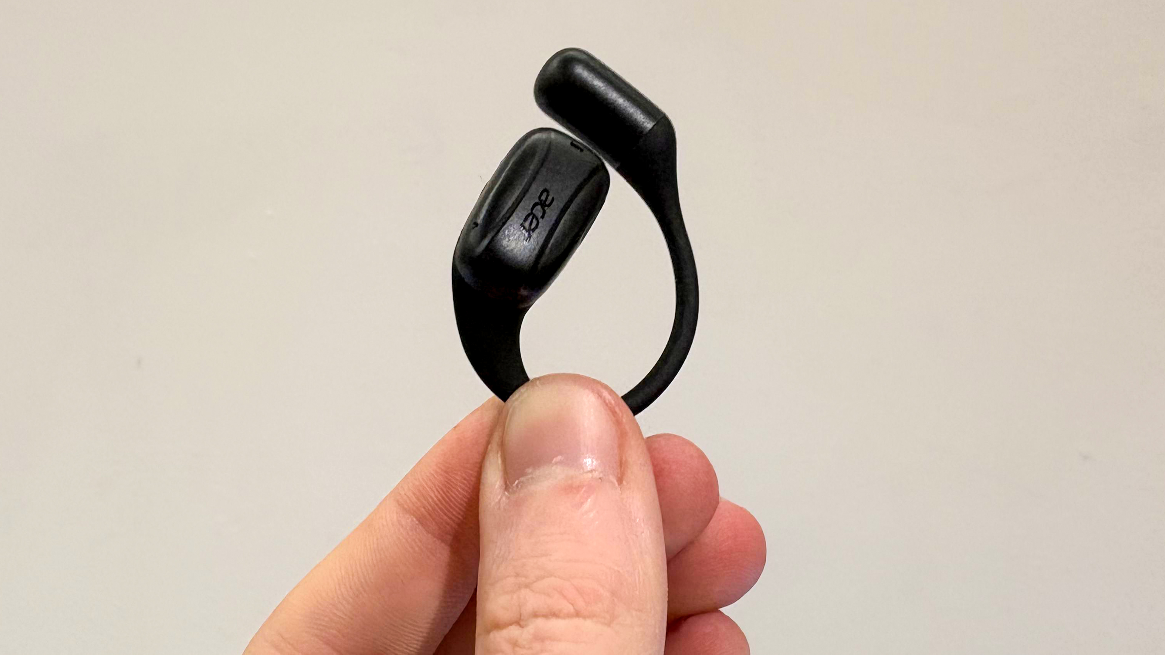 Acer AI TransBud held with fingers