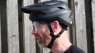 A man wearing a pair of Scott Sport Shield sunglasses and a helmet