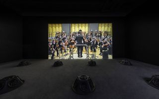 Samson Young, Muted Situations #22: Muted Tchaikovsky’s 5th 2018, HD video, eight-channel sound installation, and carpet 45 min. Courtesy of the artist