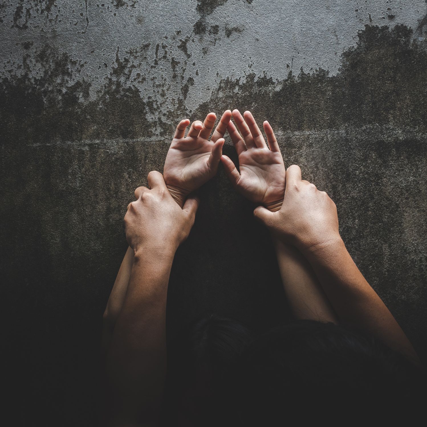 Cropped Image Of Couple Doing Sex Against Wall At Home