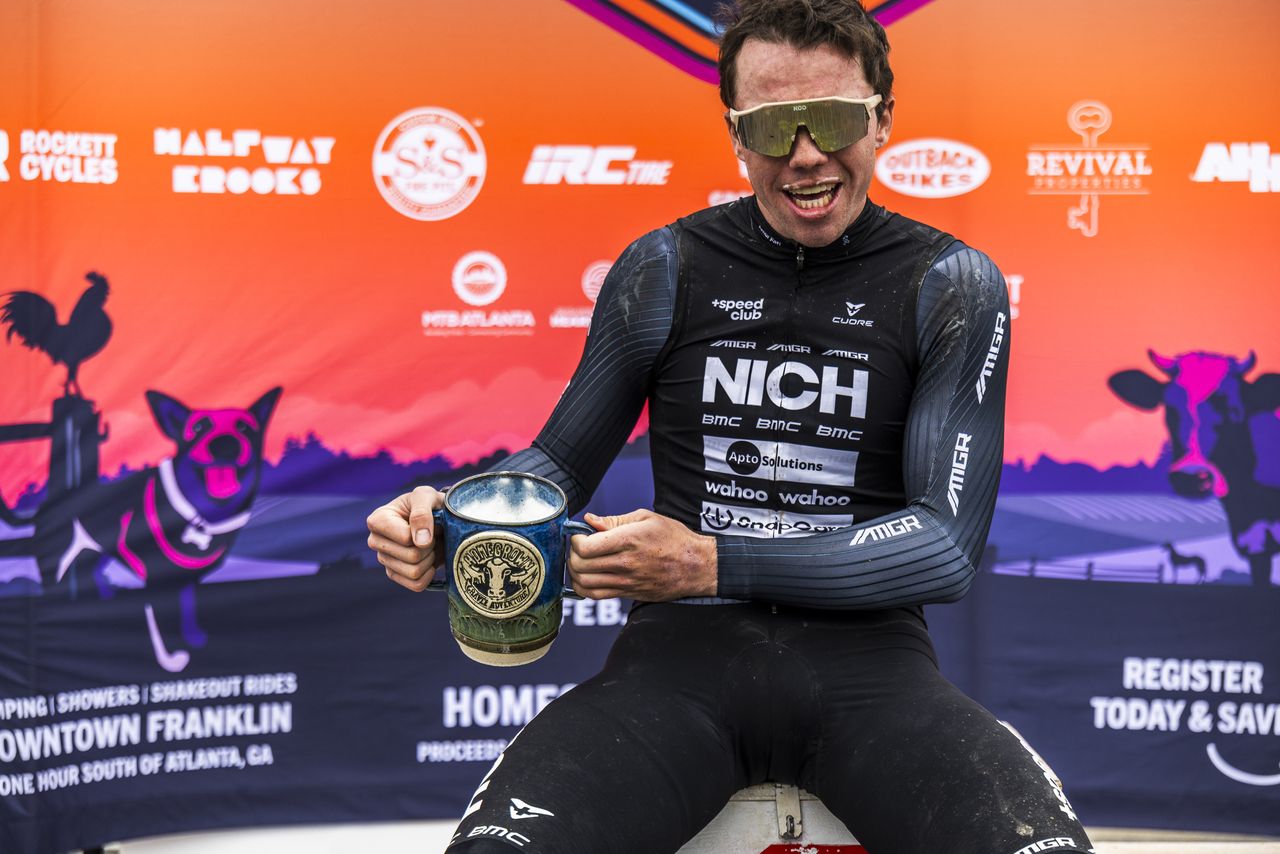 Homegrown Gravel Race men's two-time champion Michael Garrison enjoys celebratory beverage in custom winner's mug