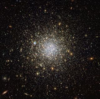 The ancient globular star cluster NGC 1466 glimmers in deep space in this new view from the Hubble Space Telescope. This spherical cluster is a collection of stars bound together by their mutual gravitational pull. It lies about 160,000 light-years from E