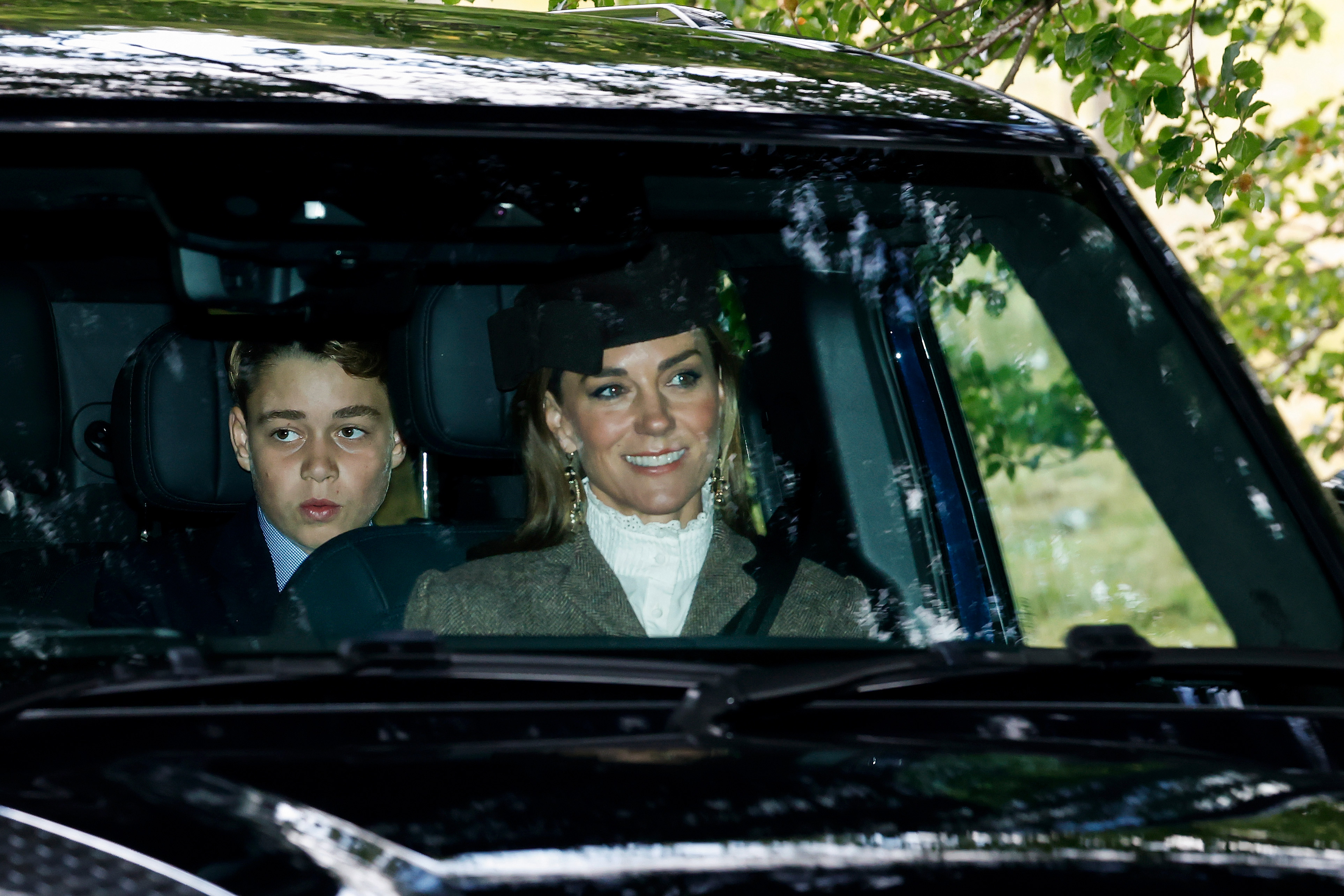 Princess Kate wears a hat with a high-neck white shirt and gray blazer to attend church in Balmoral with Prince George and Prince Louis