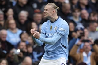 Erling Haaland celebrates after scoring for Manchester City against Brighton in March 2025.