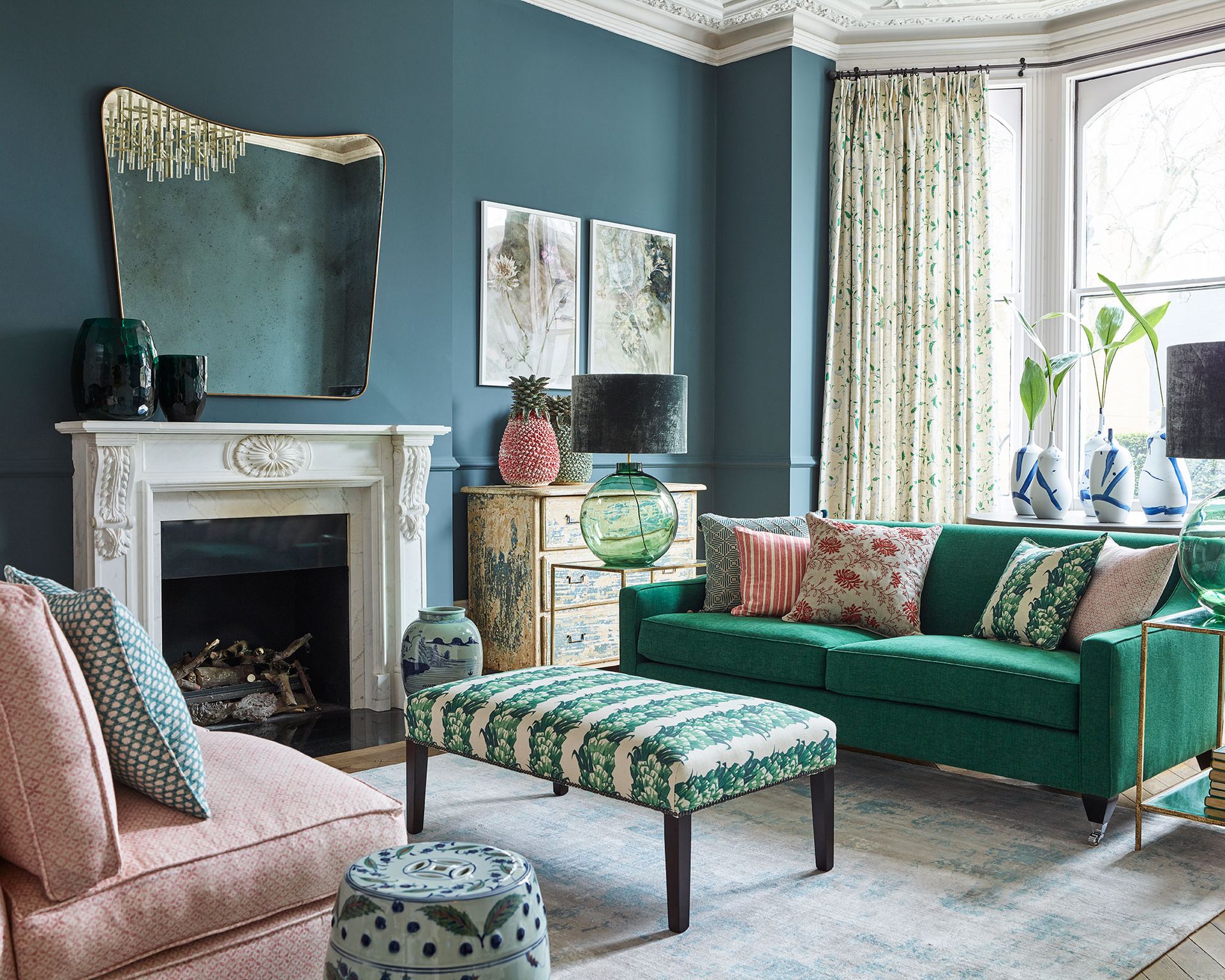 Living room with green sofa and fireplace