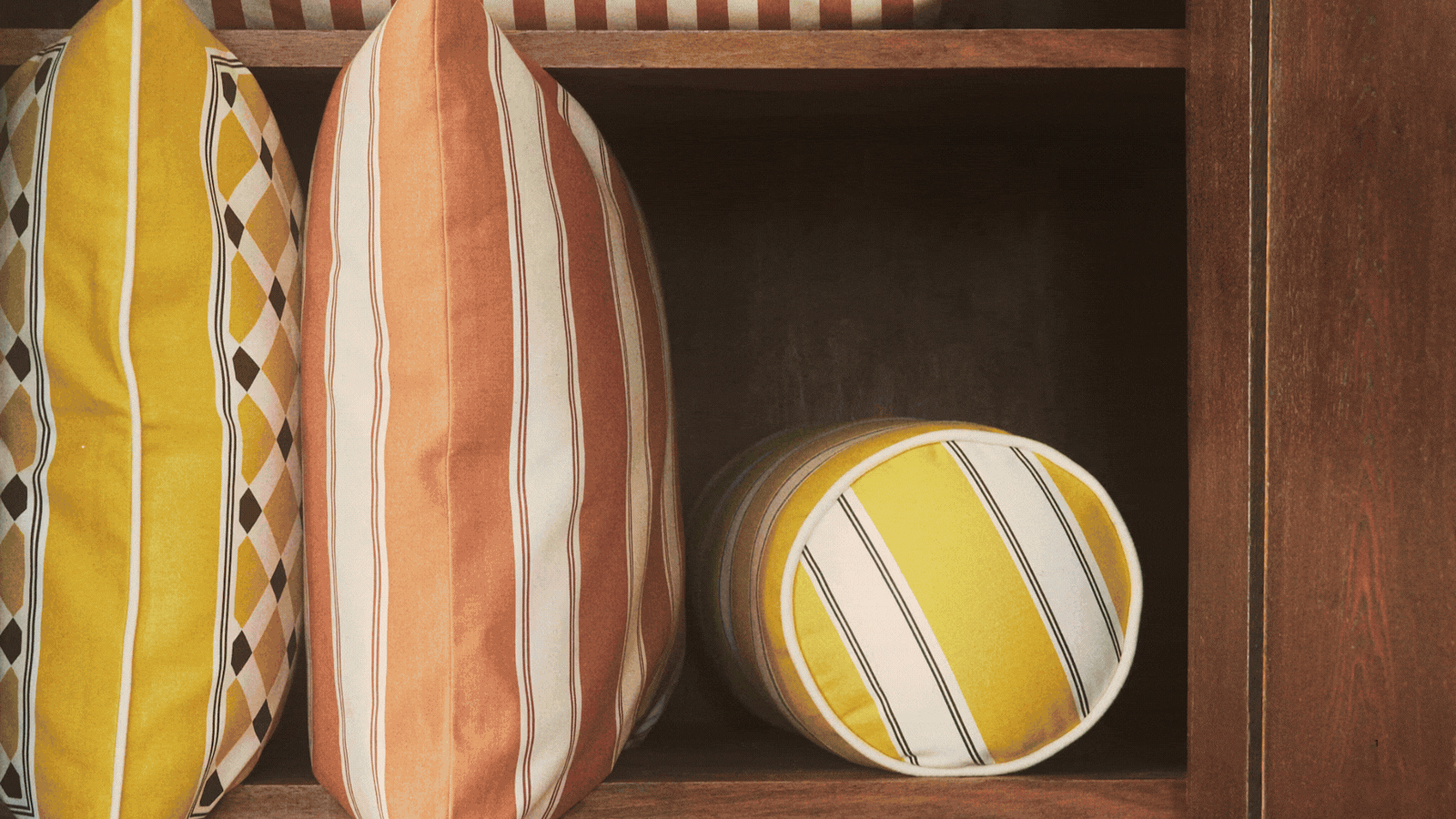 GIF of four images depicting new homeware from different brands. The images all show outdoor decor, including outdoor cushions, outdoor serveware, planter pots, and picnic dishes.
