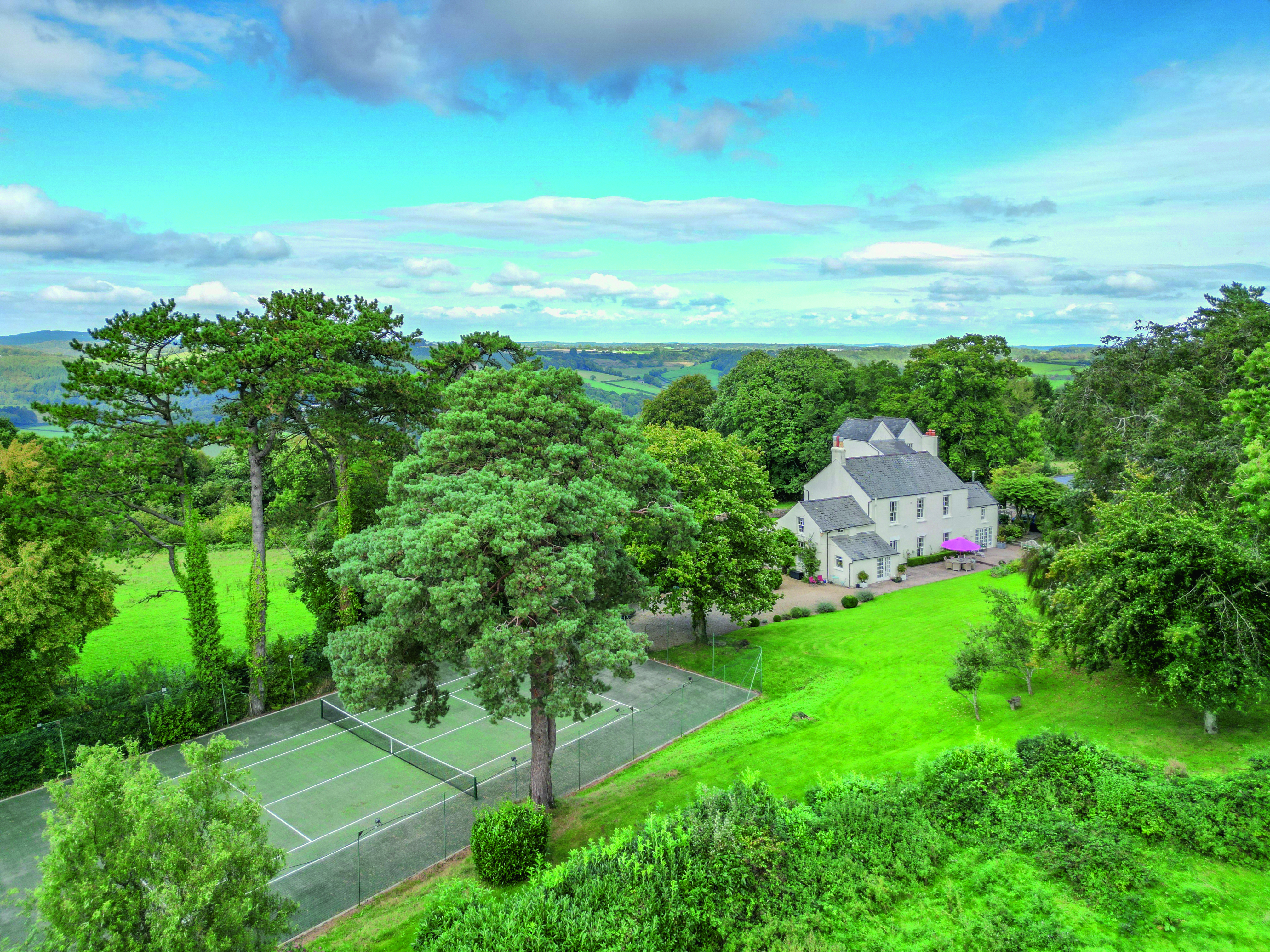Aerial view of the house and tennis court at Birchfield House.