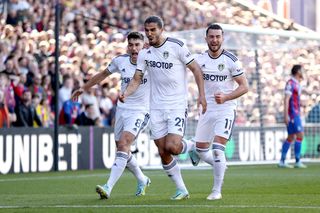 Pascal Struijk of Leeds United celebrates scoring their side's first goal with teammates Marc Roca and Illan Meslier during the Premier League match between Crystal Palace and Leeds United at Selhurst Park on October 09, 2022 in London, England.