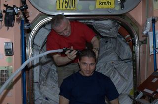 Mike Hopkins Gets Haircut Aboard ISS