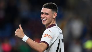  Phil Foden of Manchester City acknowledges the fans after the team's victory in the Premier League 2023/24 opener, ahead of the Super Cup Man City vs Sevilla live stream.
