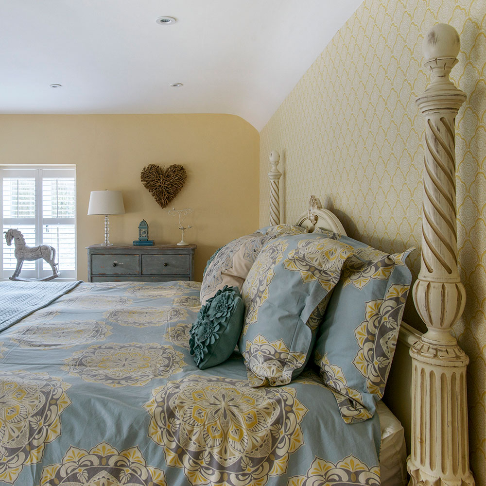 master bedroom with texture wall and white window