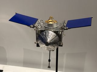 A close-up of the scale model of the OSIRIS-REx spacecraft.