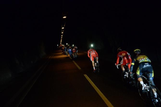 Riders passing through a tunnel