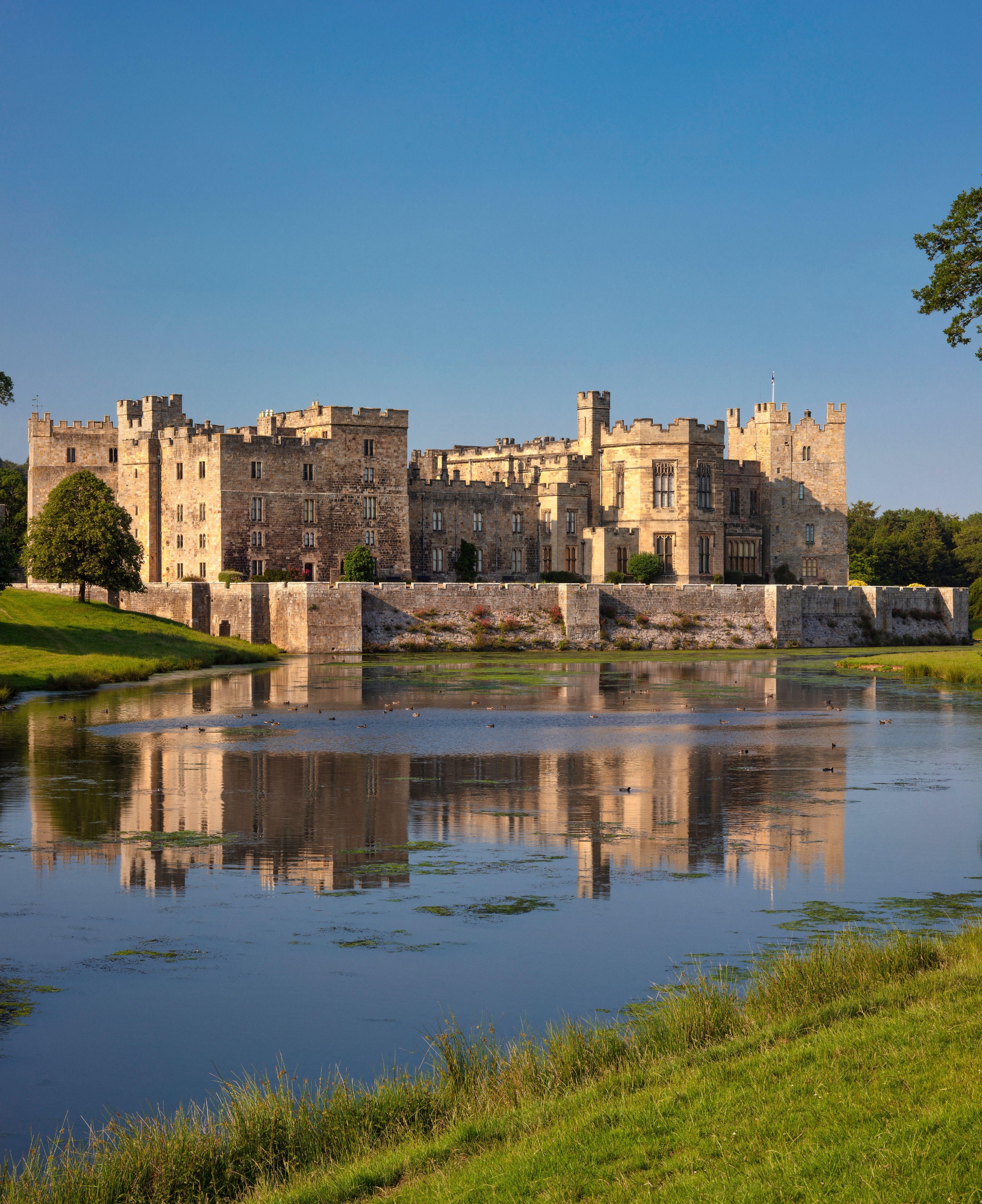 Raby Castle reflected in a lake in front of it