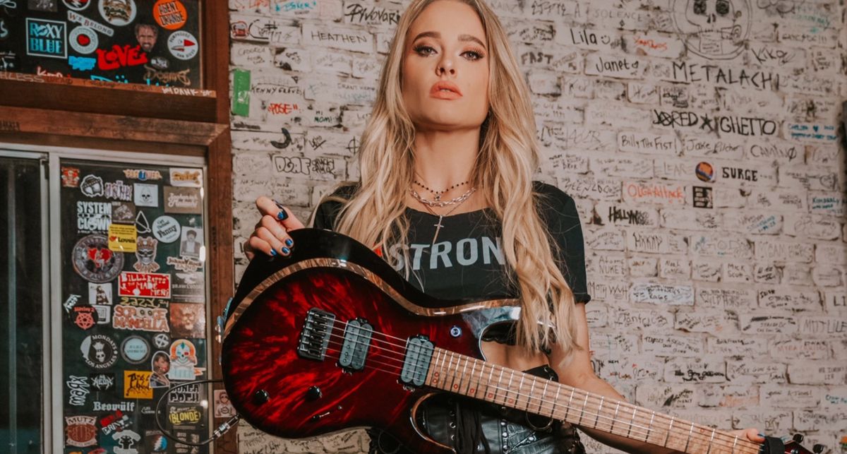 Sophie Lloyd with her signature Kiesel guitar which is being auctioned off to raise money for animal and wildlife charity Pasadena Humane Society