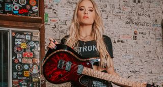 Sophie Lloyd with her signature Keisel guitar which is being auctioned off to raise money for animal and wildlife charity Pasadena Humane Society