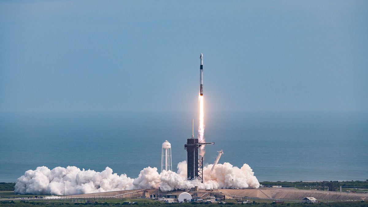 Smoke billows out from under SpaceX's Falcon 9 during its successful launch abort test on Jan. 19, 2020.