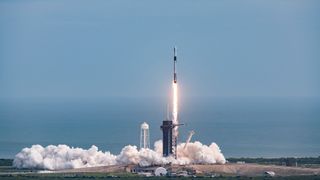 Smoke billows out from under SpaceX's Falcon 9 during its successful launch abort test on Jan. 19, 2020. 