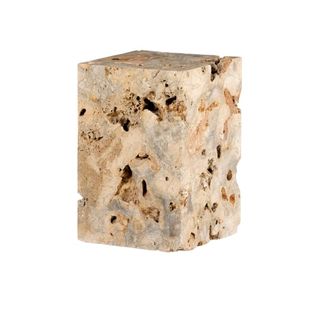 A travertine side table