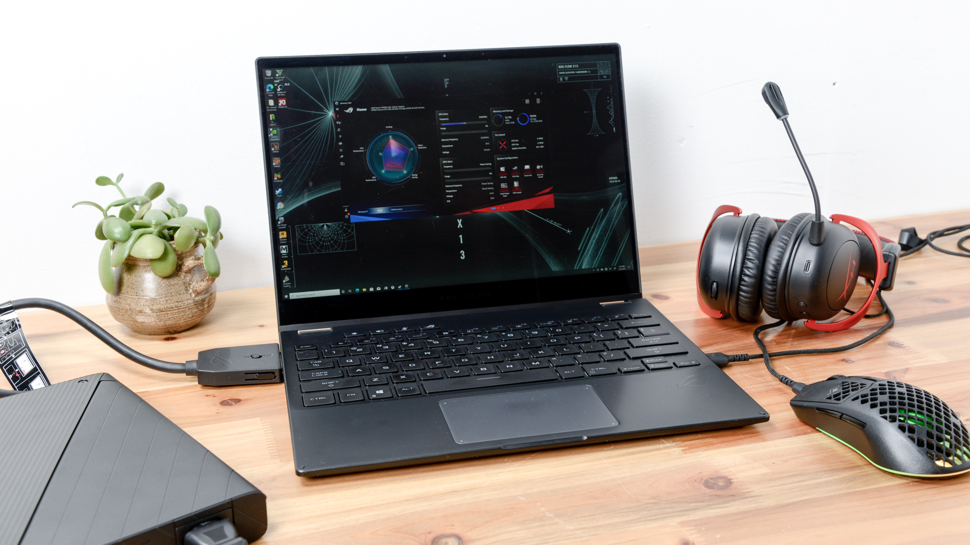 Asus ROG Flow X13/Asus ROG XG Mobile on a desk with gaming mouse and headset