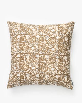 neutral square pillow with floral pattern
