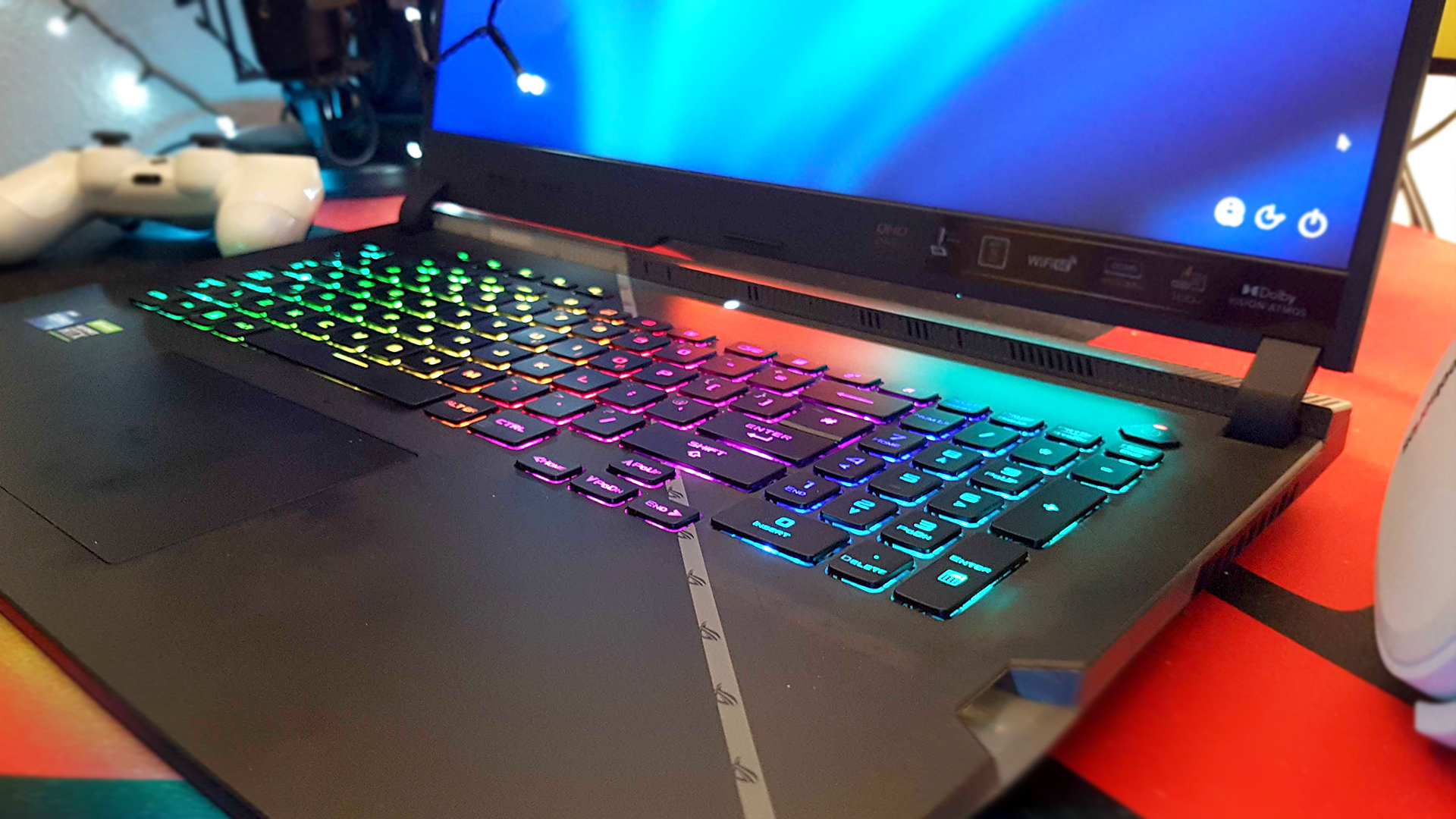 The Asus ROG Strix Scar 17 (2022) from the front, on a desk, keyboard close up.