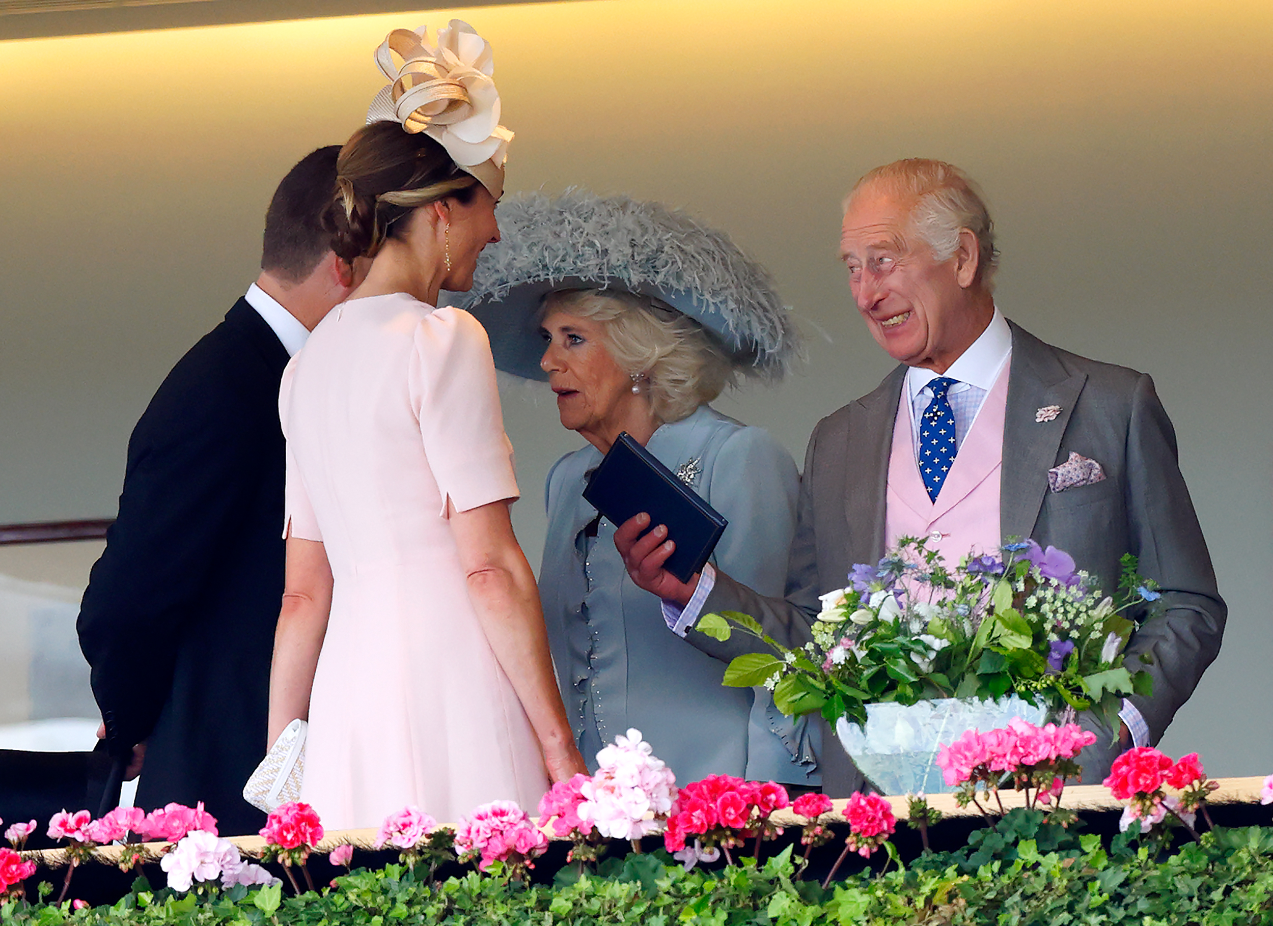 Harriet Sperling, Peter Phillips, King Charles and Queen Camilla talking to each other at Royal Ascot