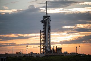 A SpaceX Falcon 9 rocket and Crew Dragon spacecraft are seen at sunset on the launch pad at Launch Complex 39A as preparations continue for the Crew-2 mission, on April 19, 2021, at NASA's Kennedy Space Center in Florida.