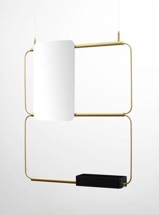 minimalist shelving system that arrives in brass and black tones