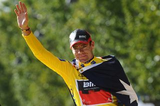 Yellow jersey of overall leader Australias Cadel Evans celebrates on the podium after he won the 2011 Tour de France cycling race on July 24 2011 at the end of the 95 km and last stagerun between Creteil and Paris ChampsElysees AFP PHOTO MIGUEL MEDINA Photo credit should read MIGUEL MEDINAAFP via Getty Images
