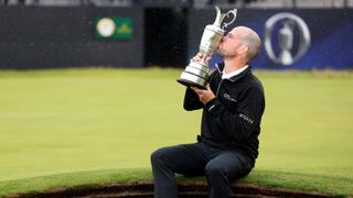Brian Harman of the United States kisses the Claret Jug whilst celebrating winning the The Open on the 18th green on Day Four of The 151st Open at Royal Liverpool Golf Club